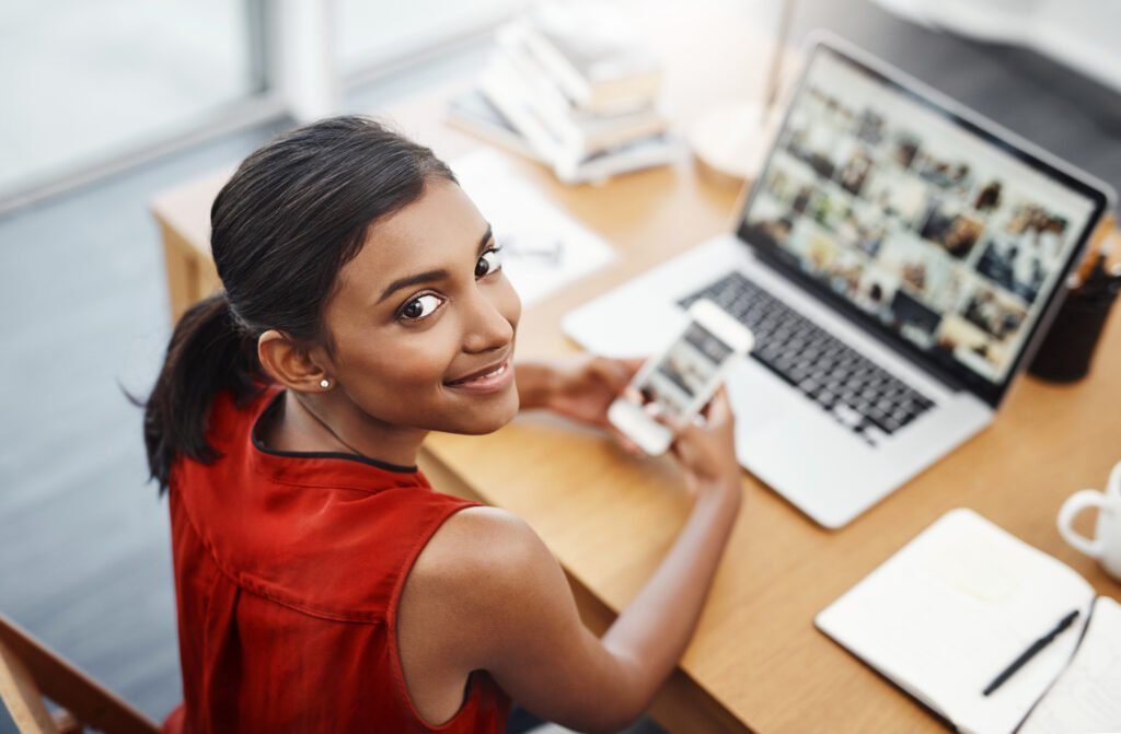 woman looking at her new website on a mobile phone